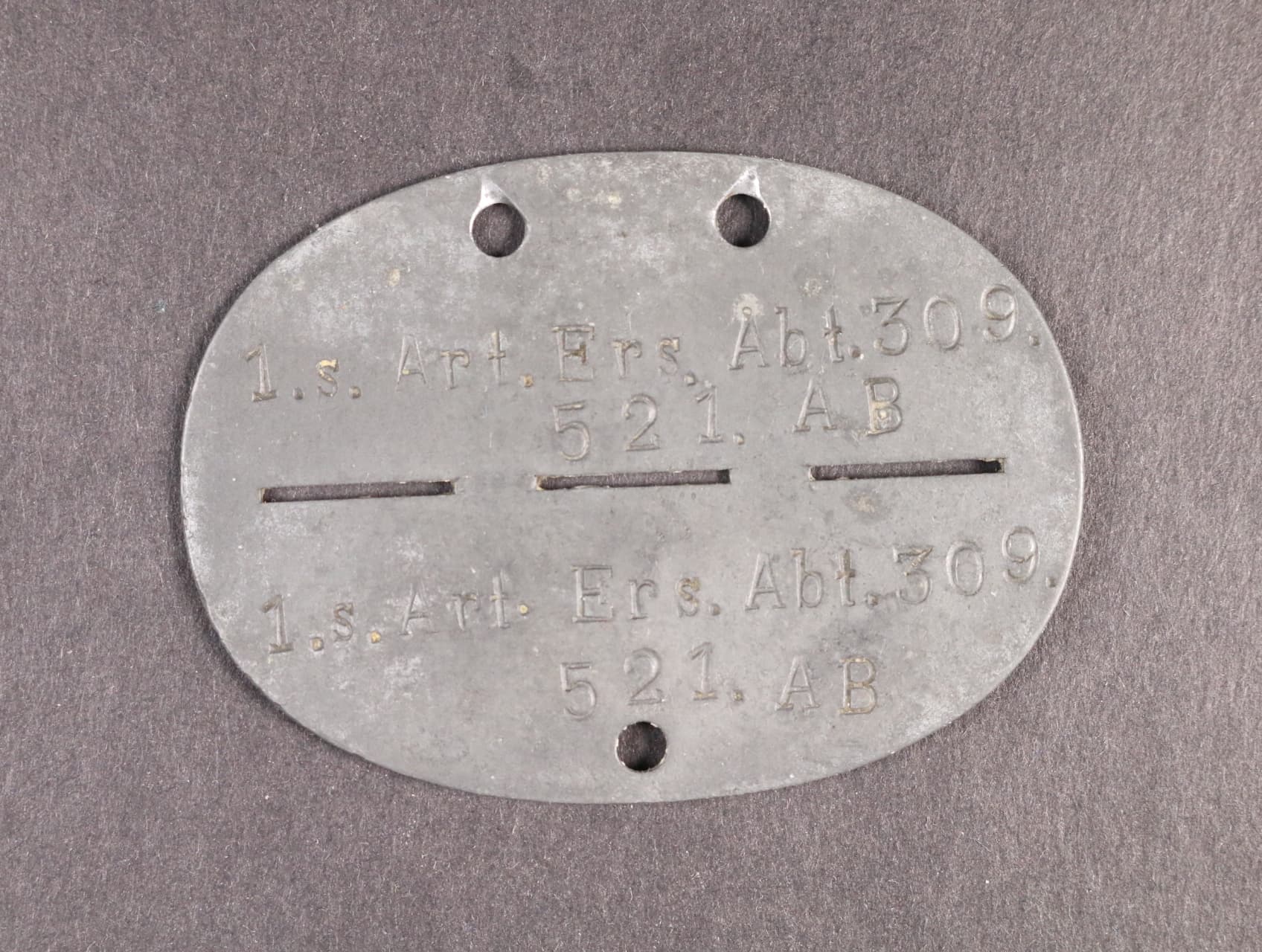Identifikační známka 1.s. Art. Ers. Abt. 309