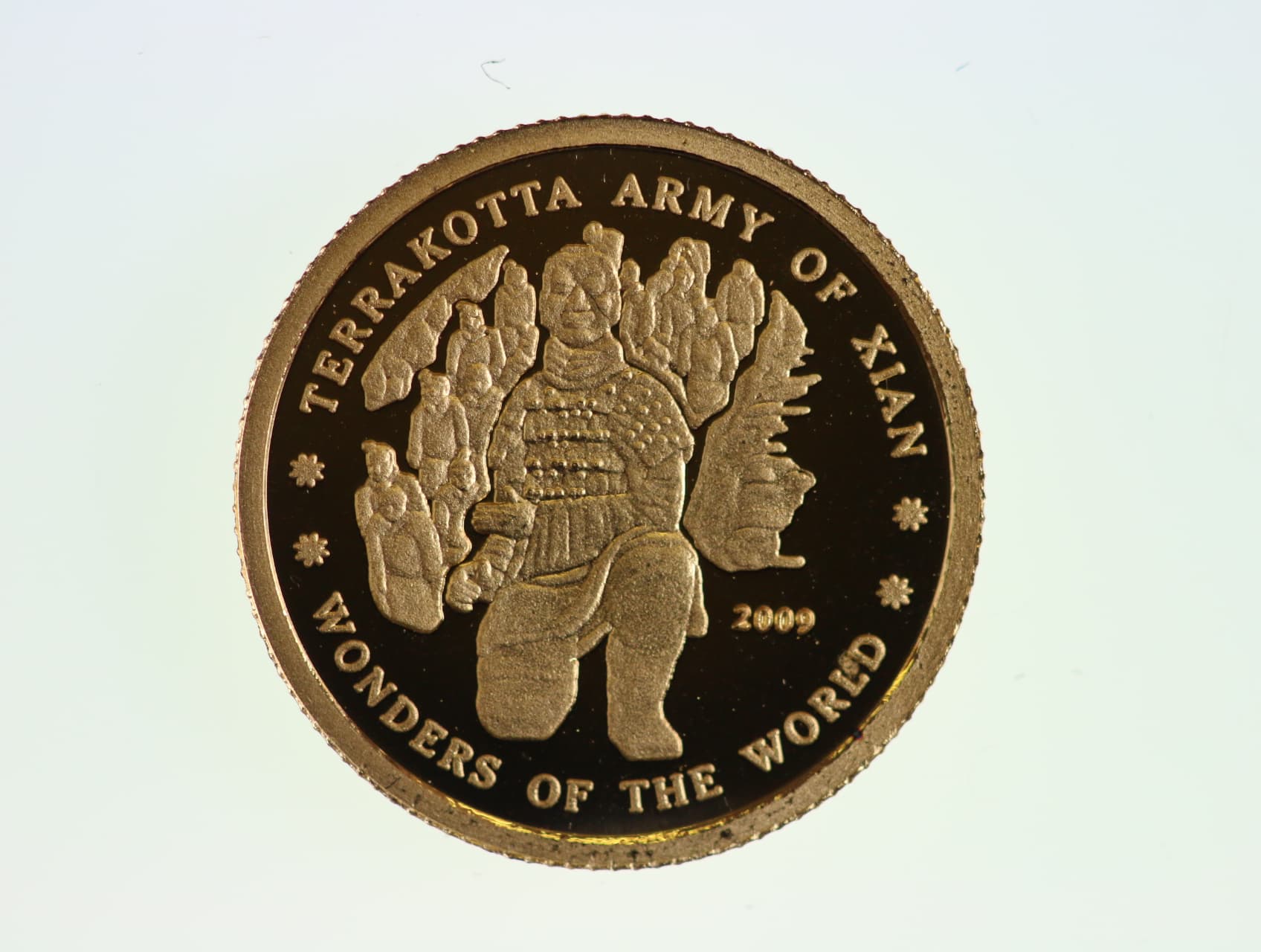 10 Wonů 2009, Terakotová armáda, Au 0.999, 1 g., průměr 13,92 mm.