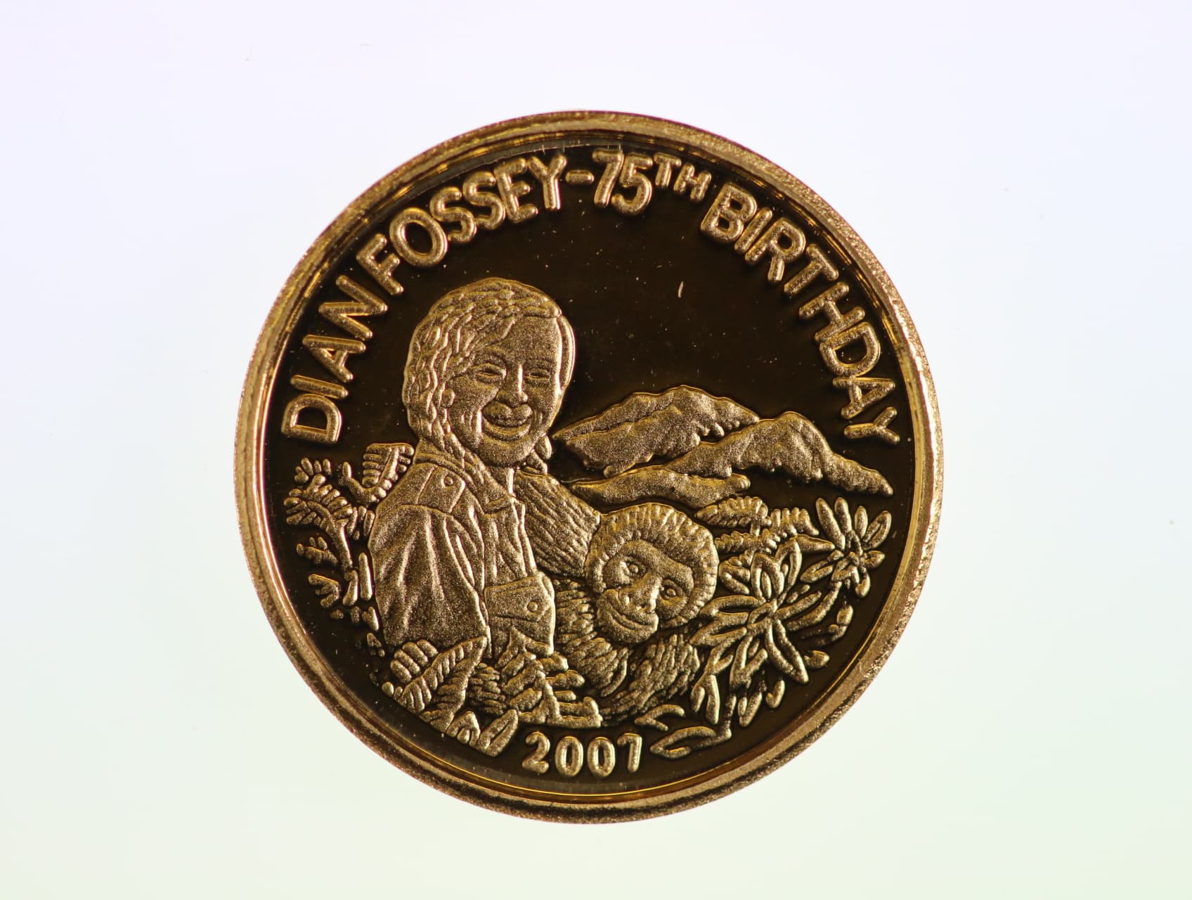 200 Franků 2007, Dian Fossey s gorilou, Au 0.999, 1 g., průměr 13,92 mm.