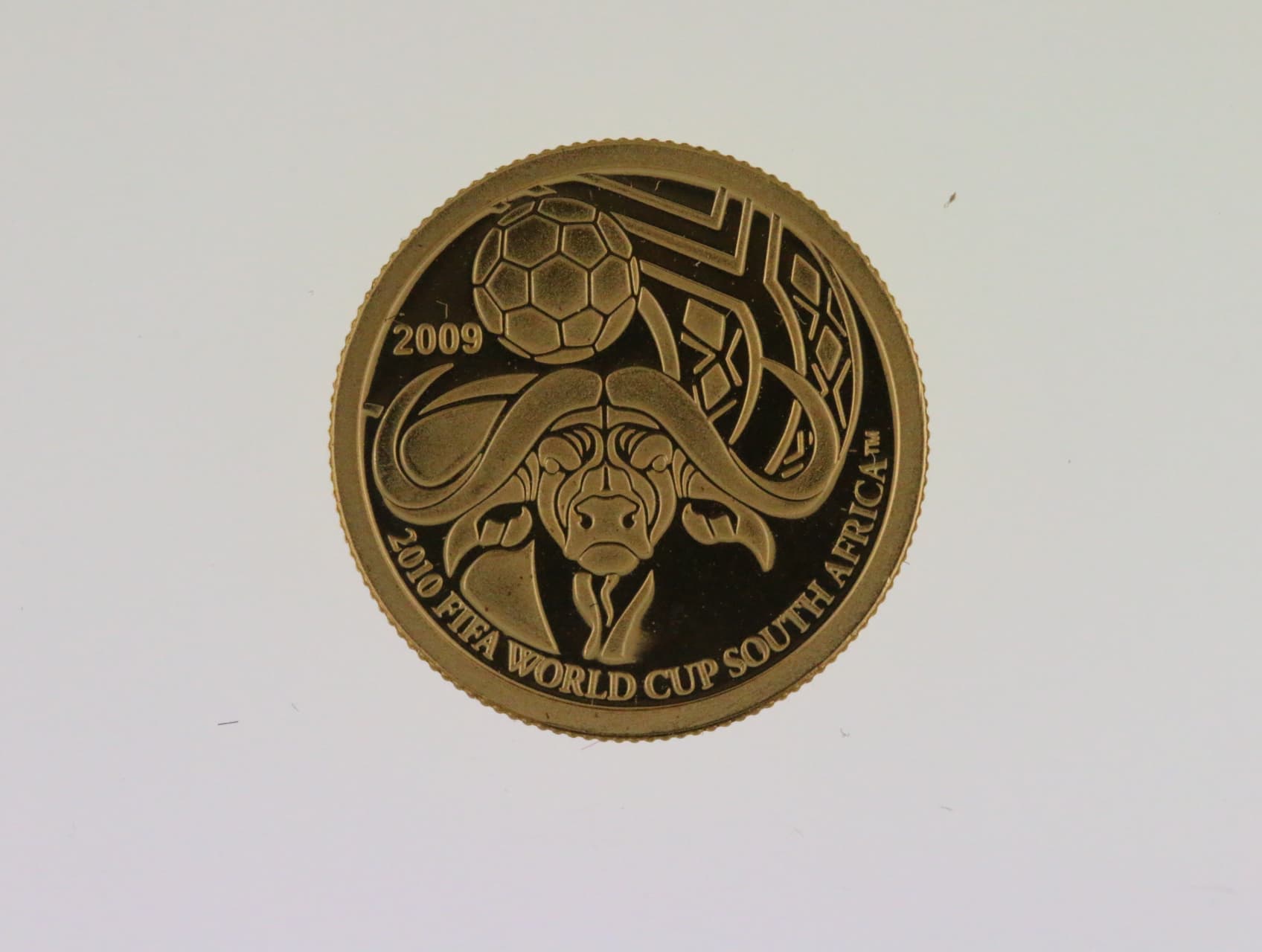 1 Dolar 2009, MS fotbal Jižní Afrika 2010, Au 0.999, 1 g., průměr 13,92 mm.