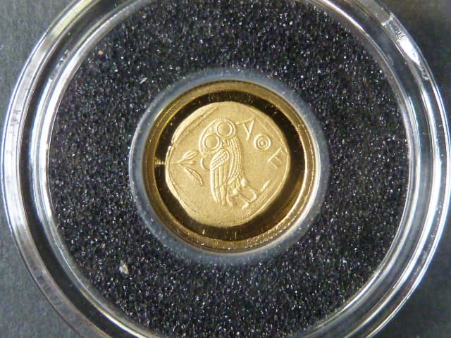 1 Francs 2009 - replika řecké mince,  Au 0,999, 0,5g, průměr 11 mm