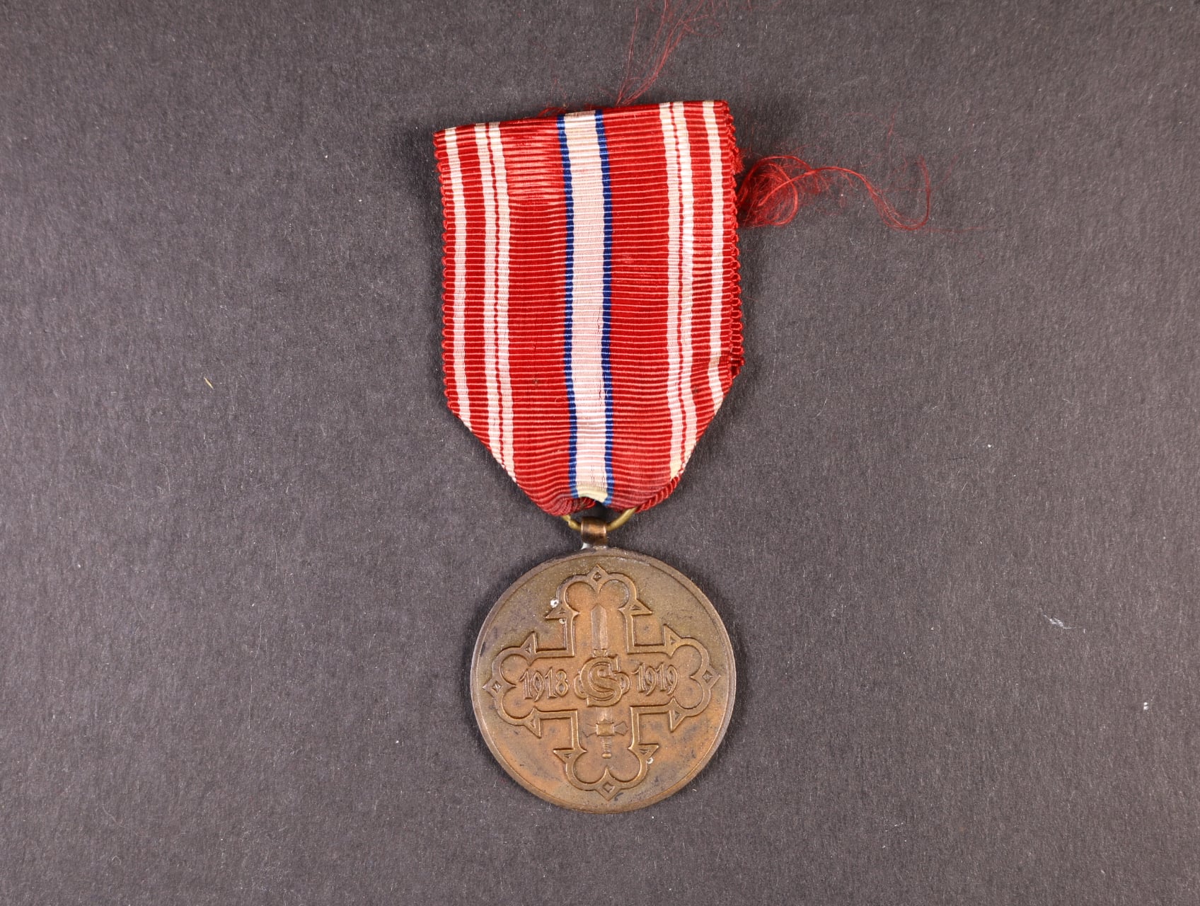 Pamětní odznak pro čs. dobrovolníky z let 1918-1919 s monogramem OP