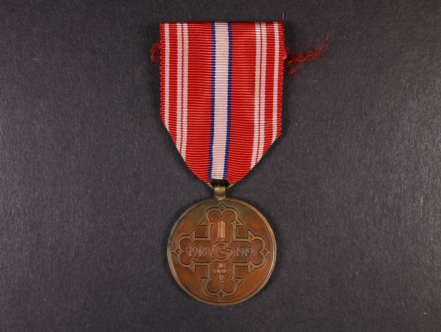 Pamětní odznak pro čs. dobrovolníky z let 1918-1919 s monogramem OP
