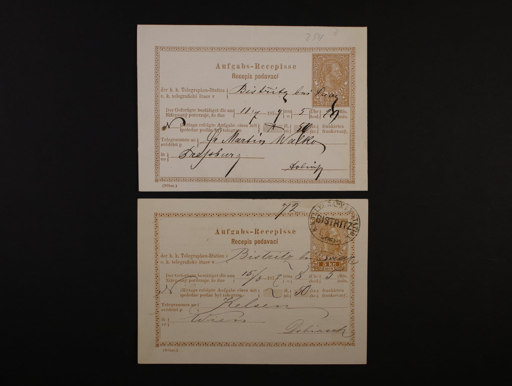 dva podací recepisy 5kr 1873, 1x spod. oválným raz. K.K. TELEGRAPHENSTATION BISTRIC a 1x s poštmistrovským přepisem, oba v r. 1877