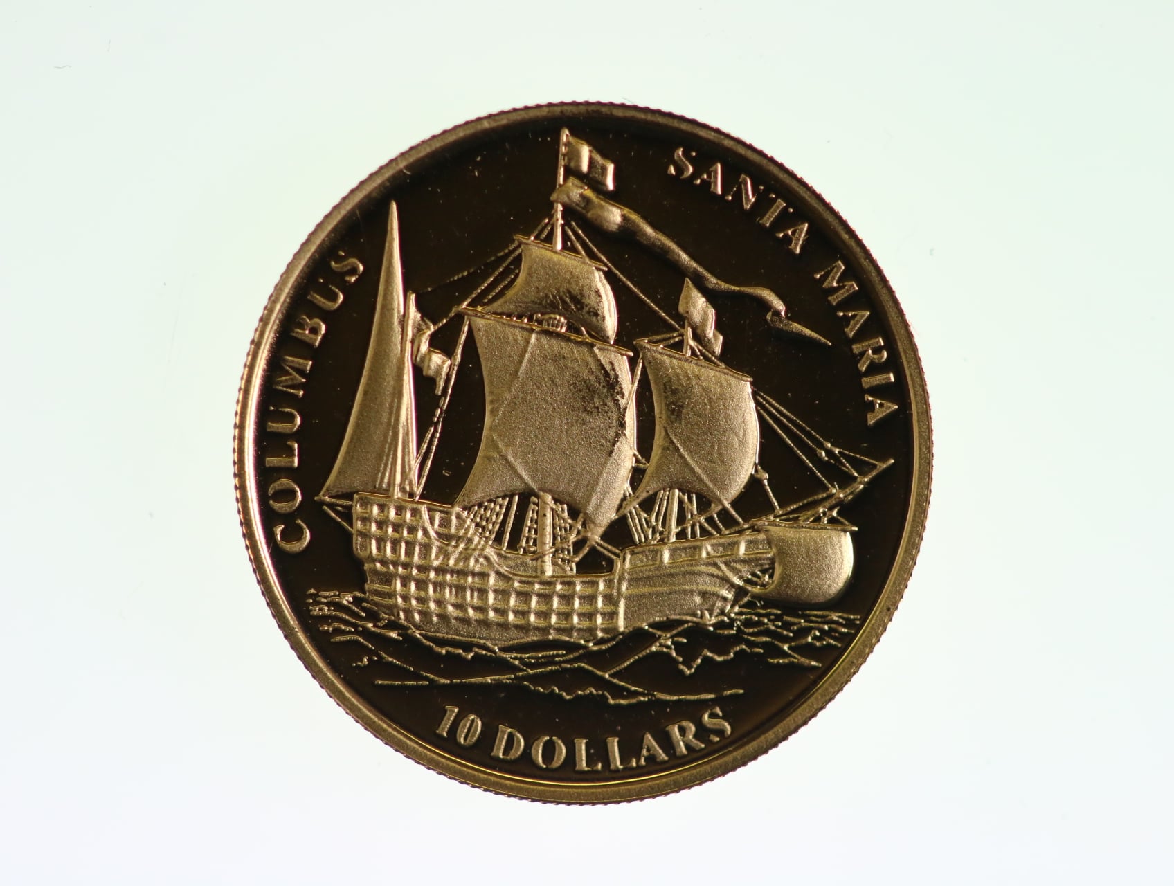 10 Dolar 2006, vlajková loď Kryštofa Kolumba Santa María, Au 0.999, 1,24 g.