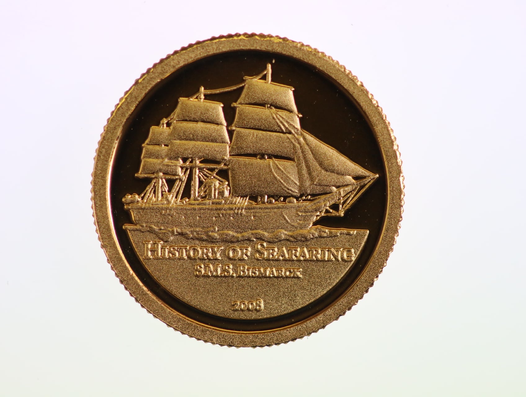 10 Dolarů 2008, SMS Bismarck, Au 0.999, 1 g., průměr 13,92 mm.