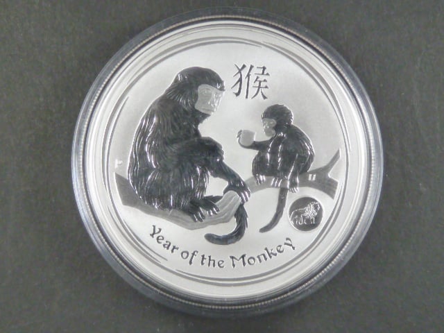 1 Dollars - 1 Oz (31,1050g)  Ag - Rok opice 2016 s kontramarkou lva, kvalita proof, Ag 999/1000, etue