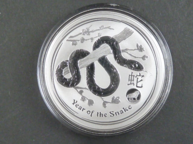 1 Dollars - 1 Oz (31,1050g)  Ag - Rok hada 2013 s kontramarkou lva, kvalita proof, Ag 999/1000, etue
