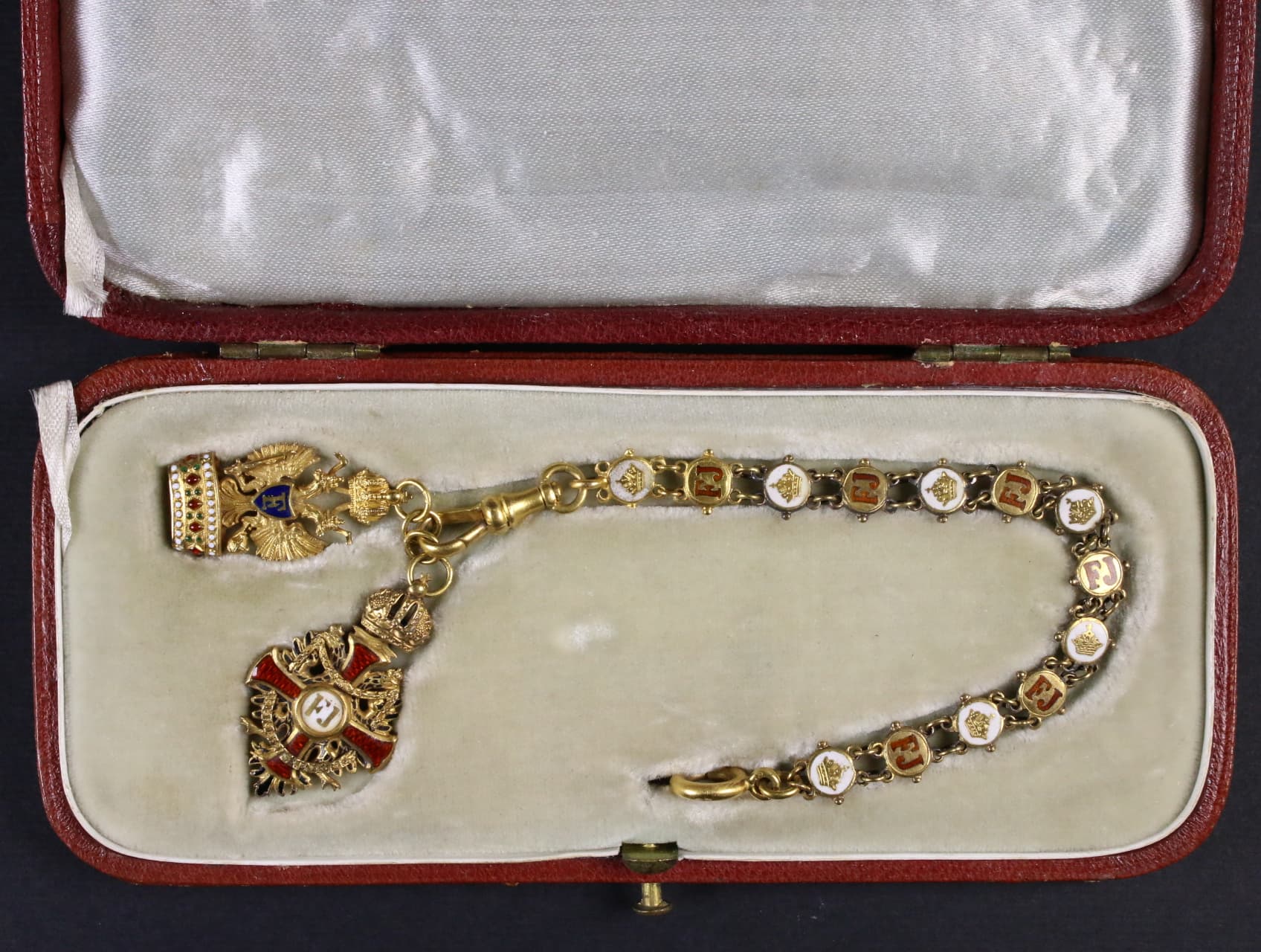 Miniatura Řádu Františka Josefa I. na řádovém řetízku, Au + miniatura Řádu železné koruny, Au v původní etui